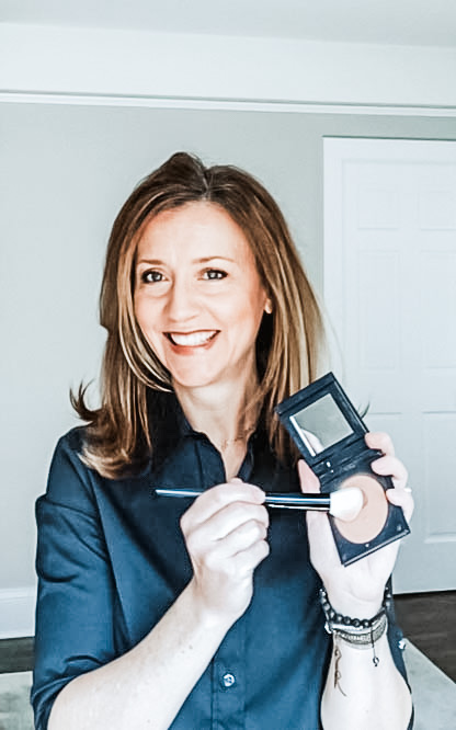 Image of Kristin Svets holding bronzer and makeup brush